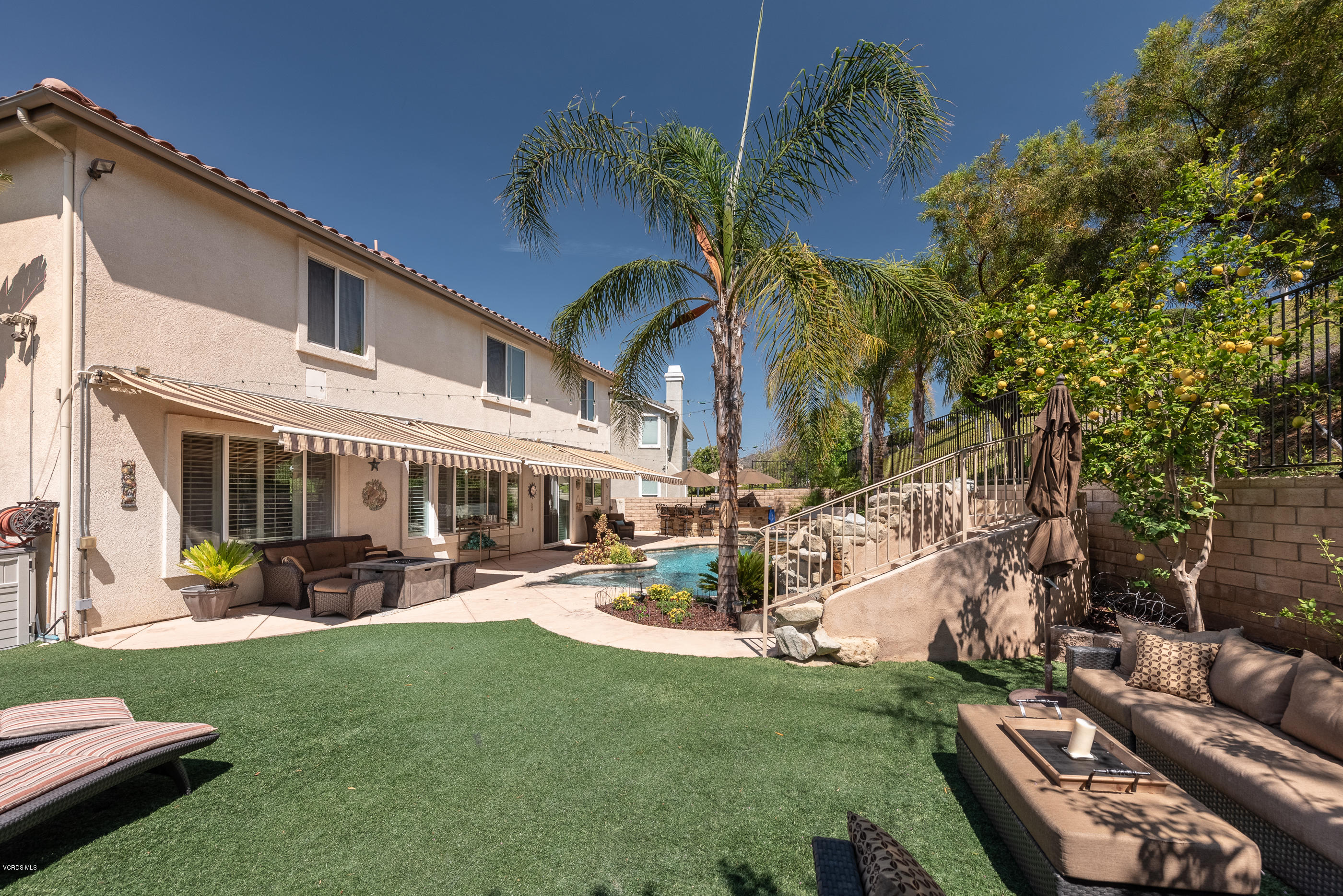 1469 Hidden Ranch Drive Simi Valley, CA 93063 - Photo 41 of 49 a view of a patio with couches table and chairs and potted plants