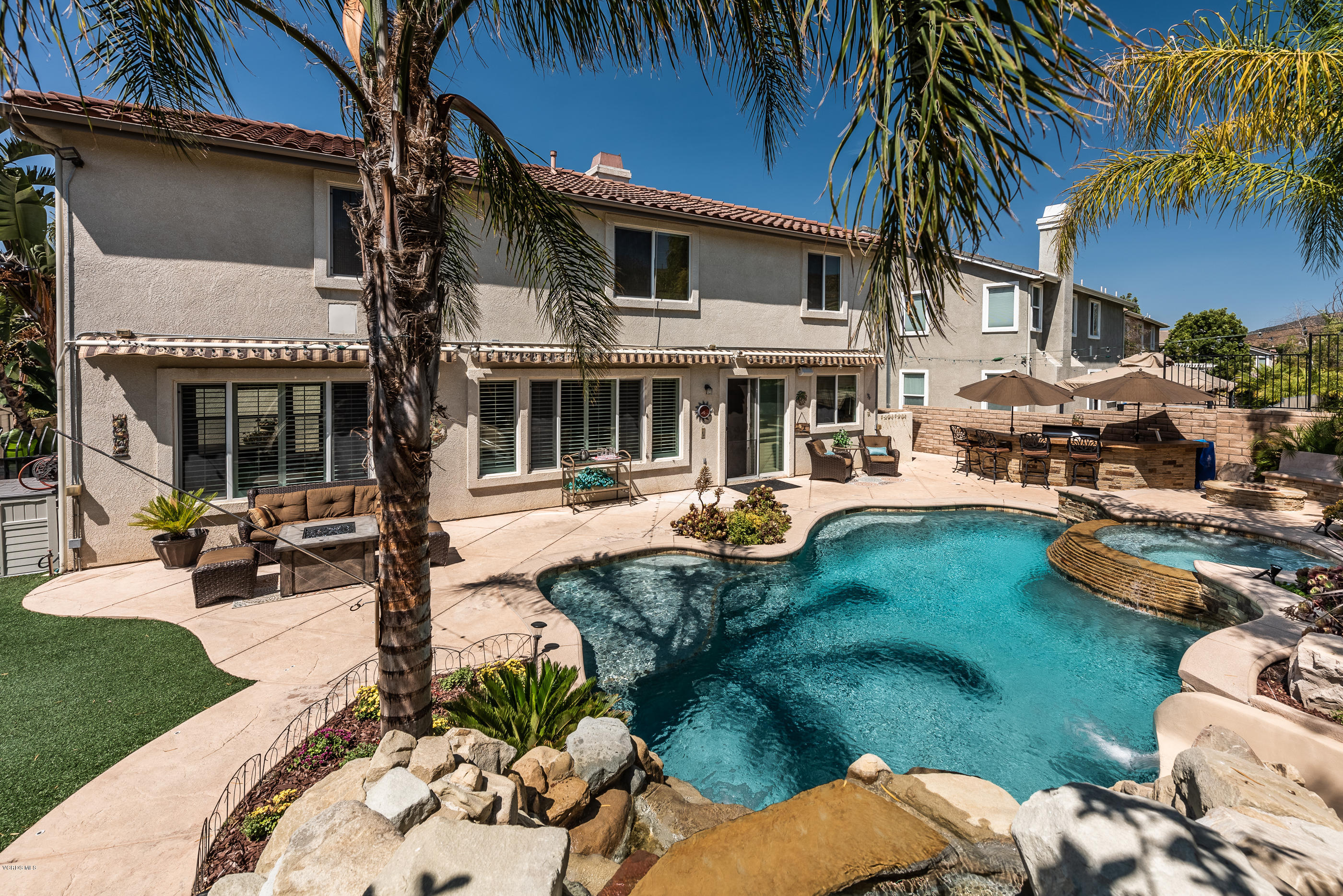 1469 Hidden Ranch Drive Simi Valley, CA 93063 - Photo 47 of 49 a front view of a house with garden and sitting area