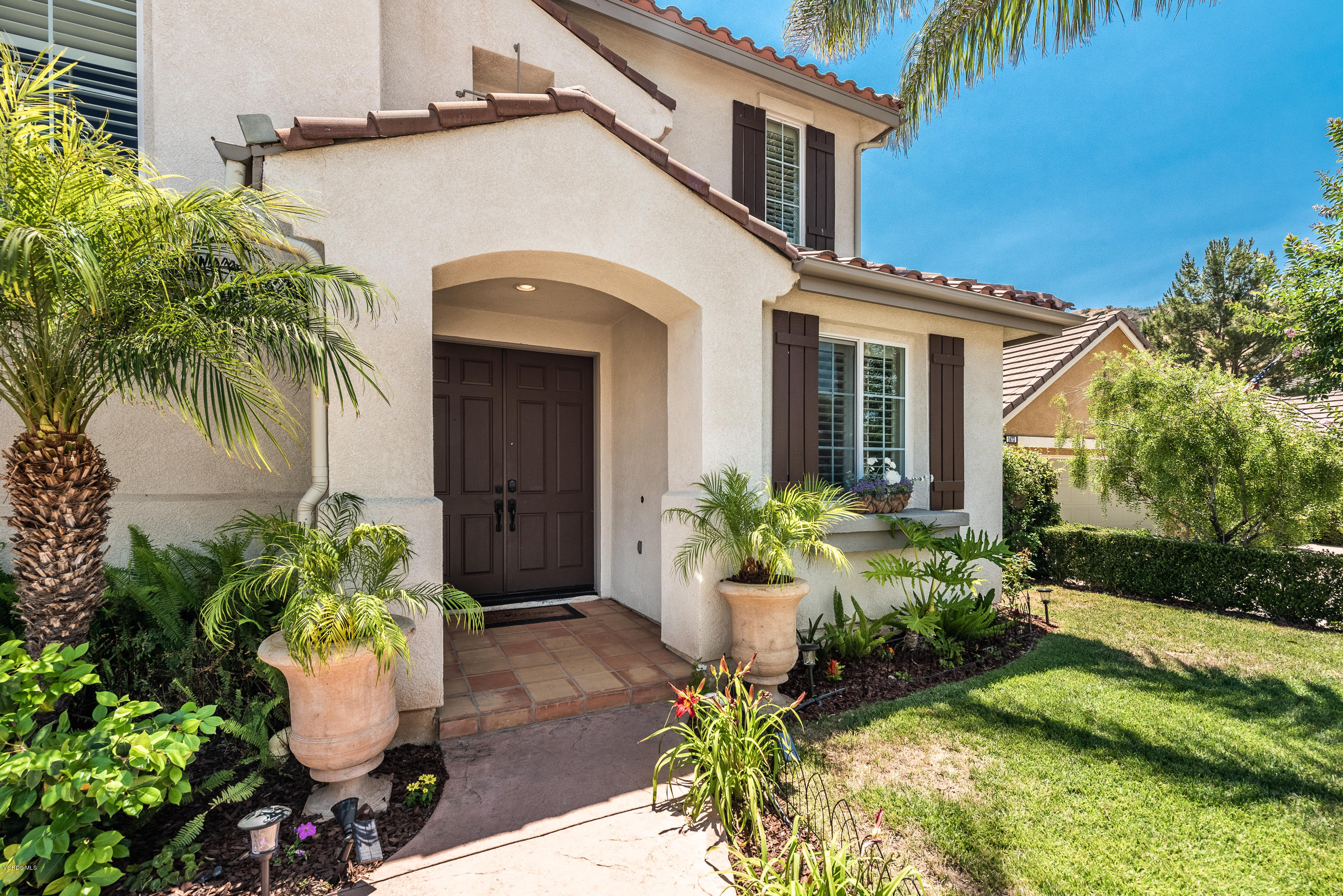1469 Hidden Ranch Drive Simi Valley, CA 93063 - Photo 6 of 49 a front view of a house with a garden