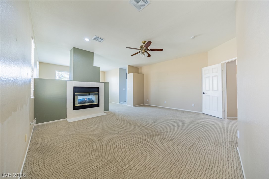 2504 Putting Green Drive Henderson, NV 89074 - Photo 27 of 56 This room features a fireplace and offers ample space for relaxation and entertainment.