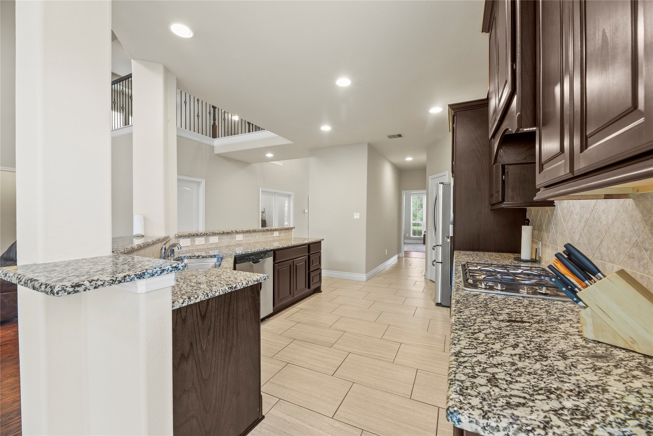 3834 Trophy Ridge Drive Spring, TX 77386 - Photo 14 of 43 a large bathroom with a granite countertop sink a toilet and a mirror
