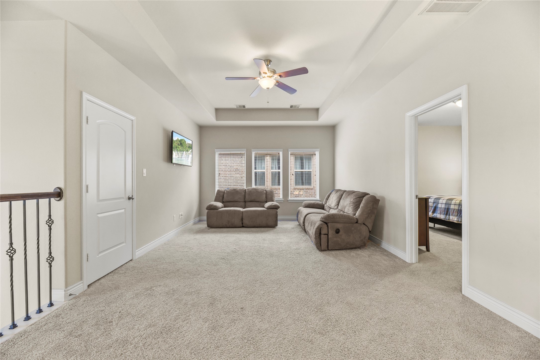 3834 Trophy Ridge Drive Spring, TX 77386 - Photo 28 of 43 a living room with furniture and a chandelier