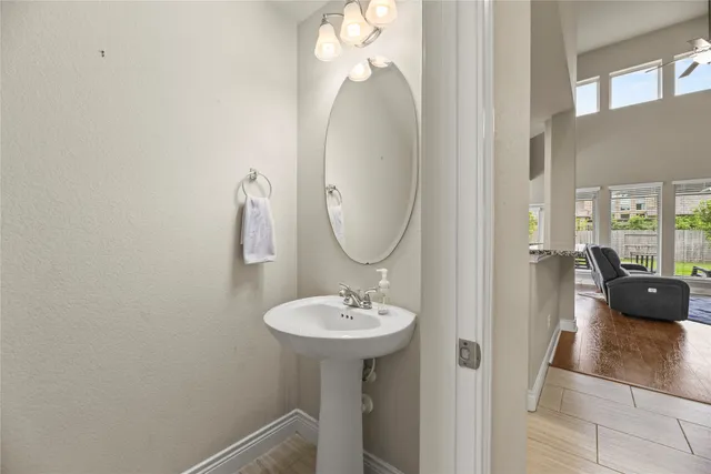 a bathroom with a sink and a mirror