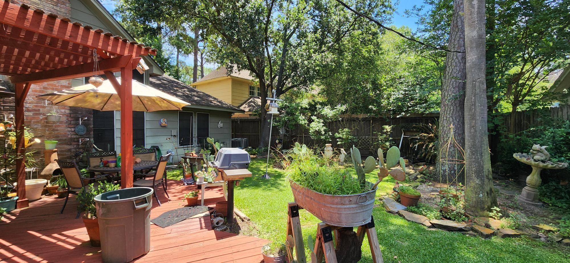 16155 Hexham Drive Spring, TX 77379 - Photo 45 of 47 a view of a chair and table in backyard of the house