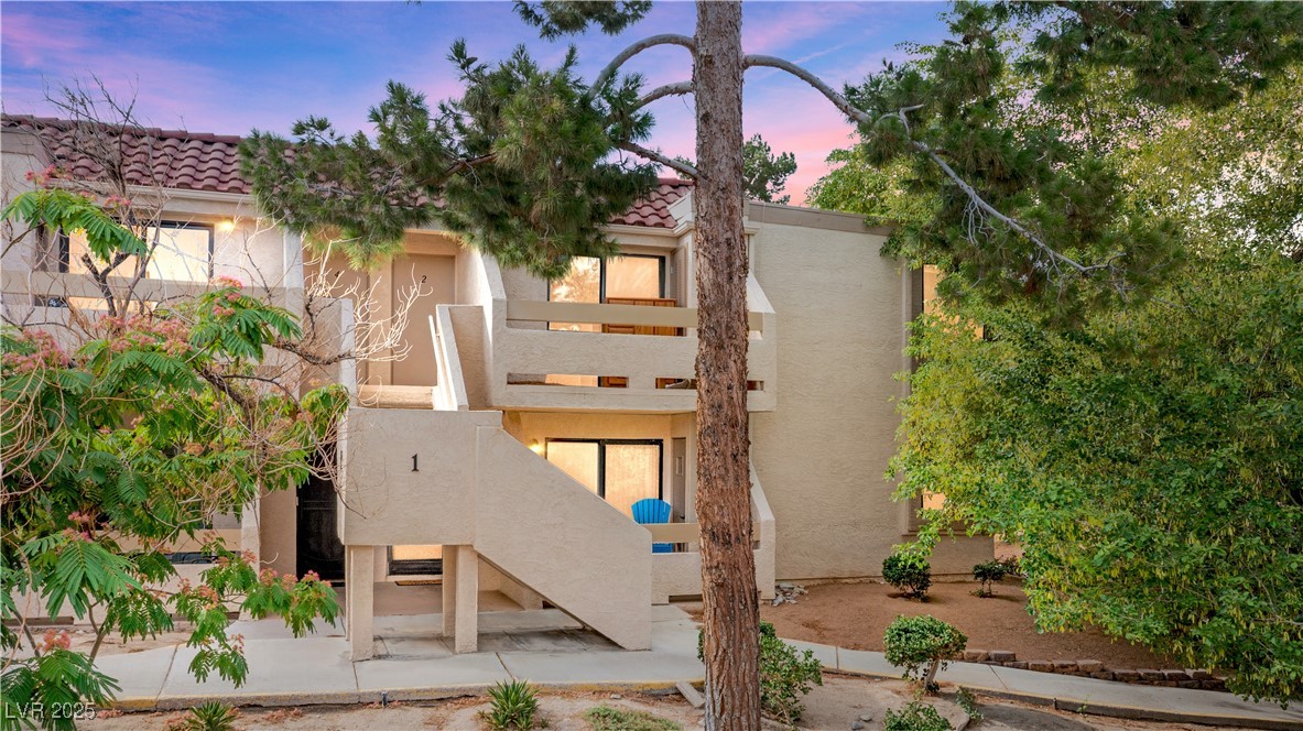 3740 Desert Marina Drive, Unit 2 Laughlin, NV 89029 - Photo 2 of 75 View of front facade featuring stucco siding and a tile roof