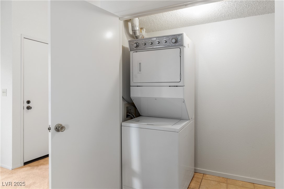 3740 Desert Marina Drive, Unit 2 Laughlin, NV 89029 - Photo 30 of 75 Laundry closet featuring stacked washer / drying machine