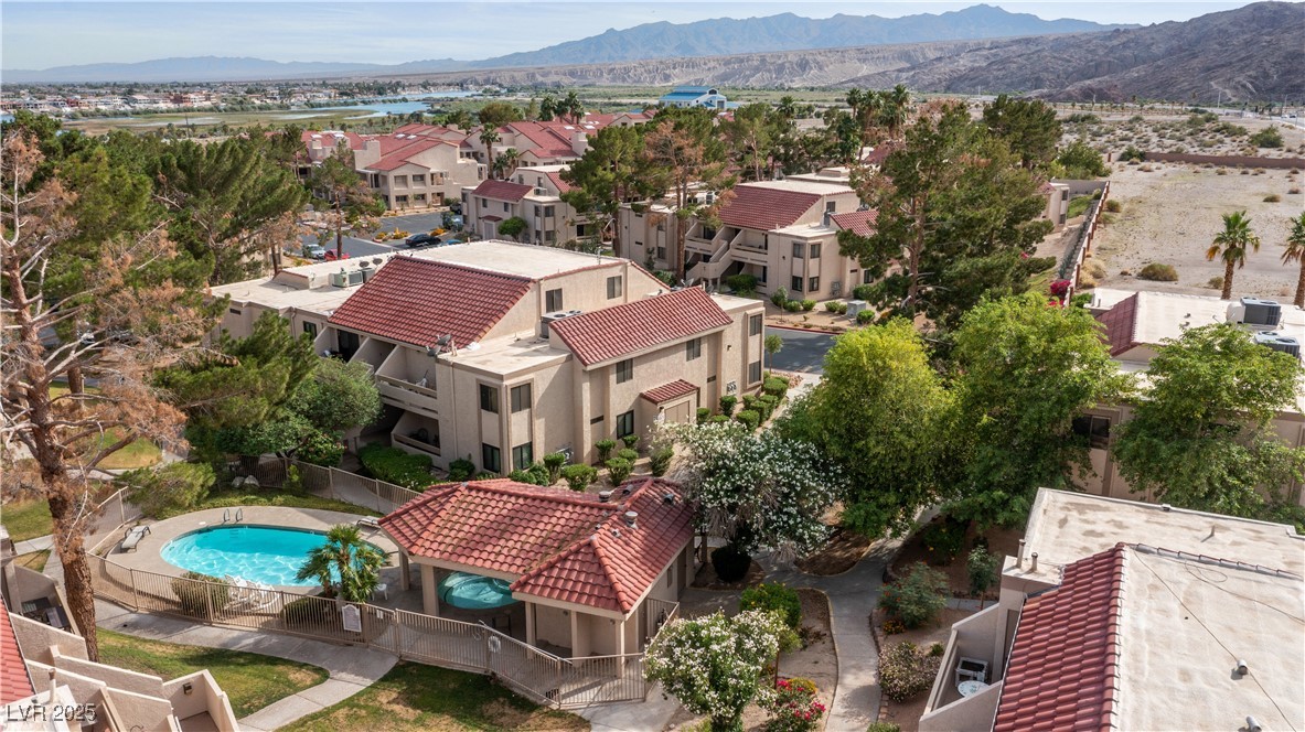 3740 Desert Marina Drive, Unit 2 Laughlin, NV 89029 - Photo 51 of 75 Aerial perspective of suburban area featuring a mountain backdrop and a pool
