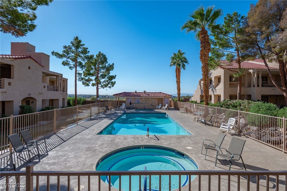 3740 Desert Marina Drive, Unit 2 Laughlin, NV 89029 - Photo 62 of 75 3rd Community pool with a hot tub and a patio area