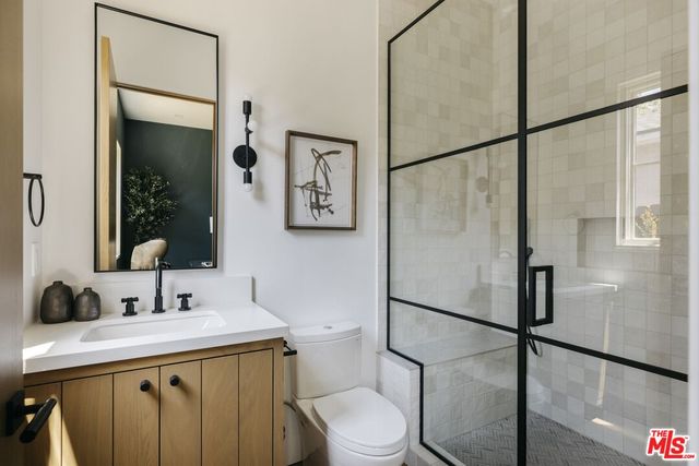 a bed room with a bed and a chair