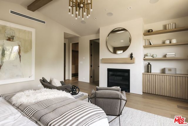 a spacious bathroom with double vanity and a bathtub
