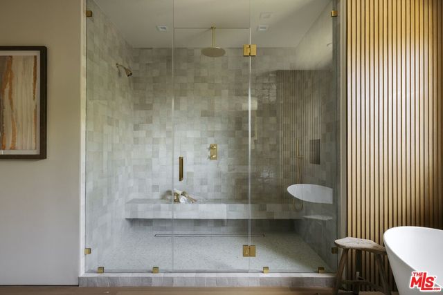a bathroom with a bathtub and shower