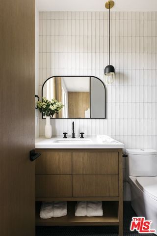 a bedroom with a bed and a table