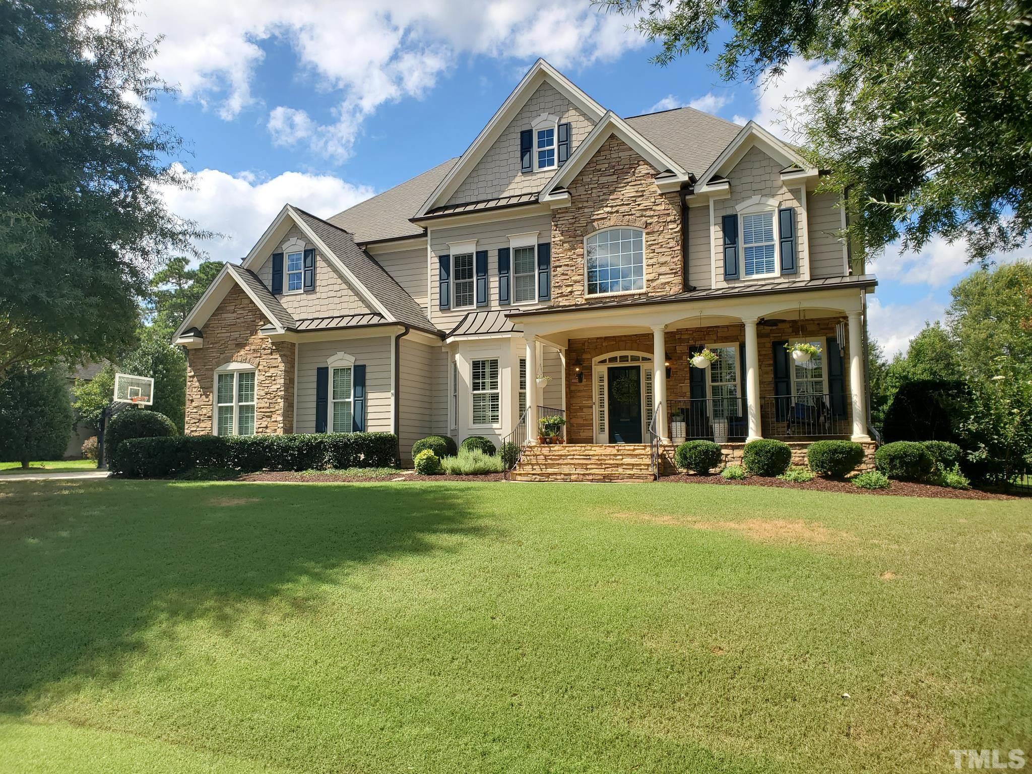 2620 Branston Way Apex, NC 27539 - Photo 1 of 30 a front view of a house with a garden and porch