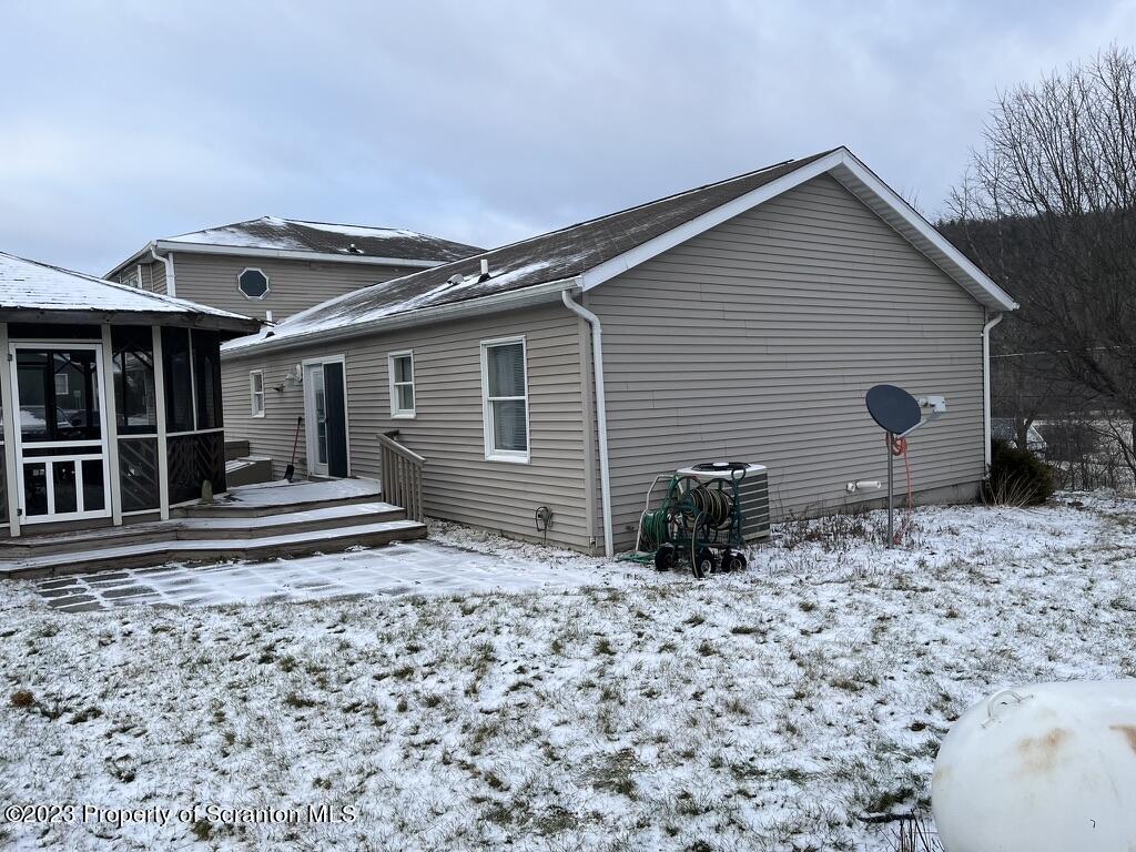 14651 Highway 858 Little Meadows, PA 18830 - Photo 12 of 51 a view of a house with wooden floor and a yard