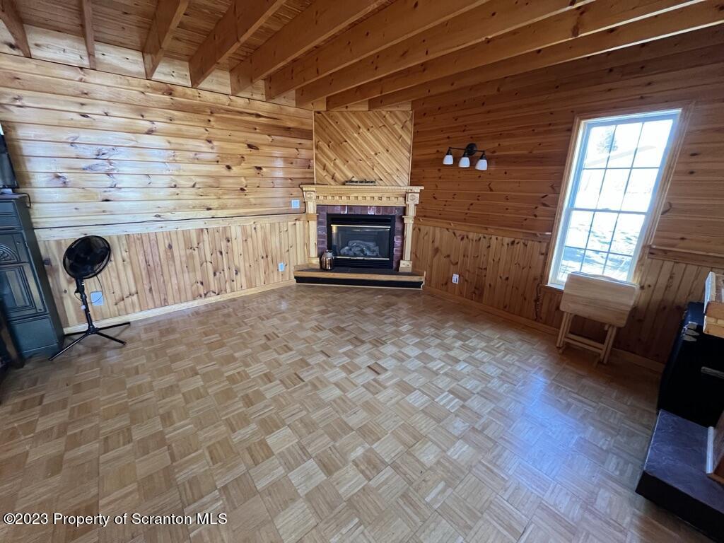 14651 Highway 858 Little Meadows, PA 18830 - Photo 19 of 51 a living room with furniture and a fireplace