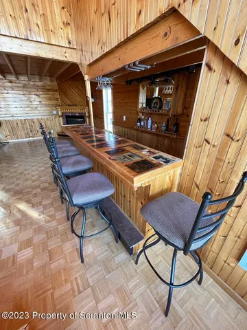 a bedroom with a bed rug and wooden floor
