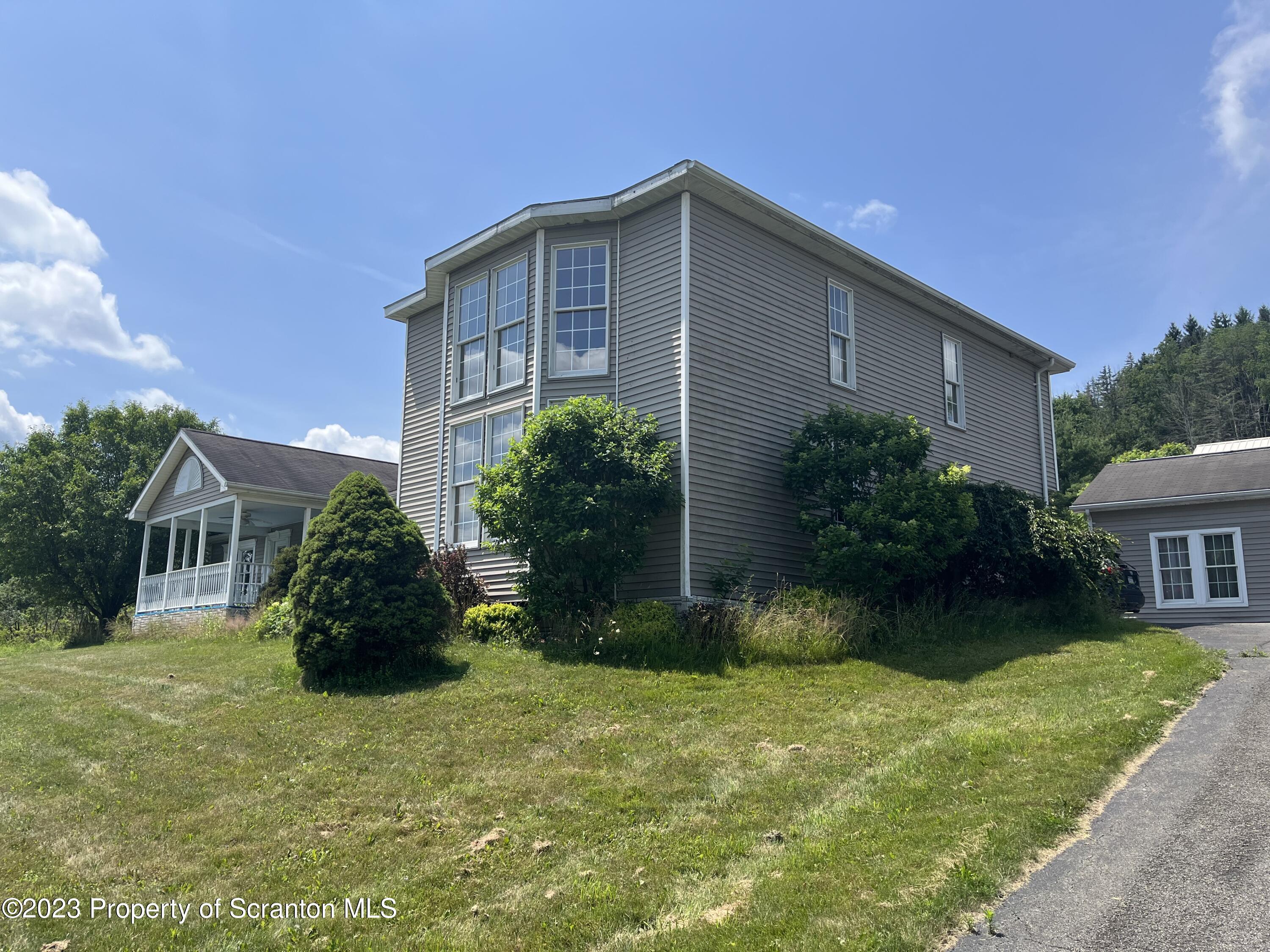 14651 Highway 858 Little Meadows, PA 18830 - Photo 2 of 51 a view of a house with a yard and plants