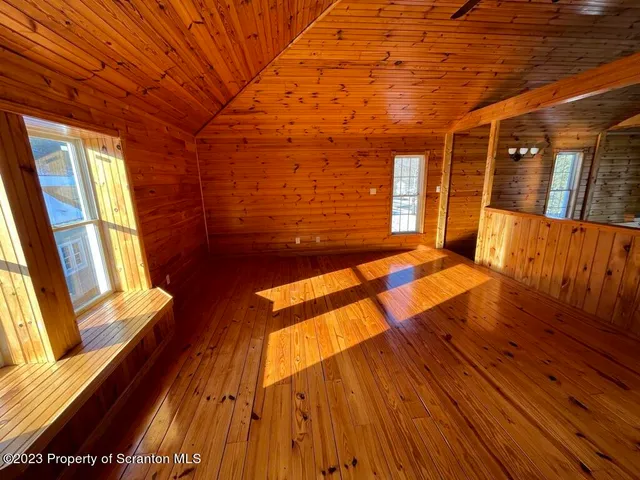 a living room with rug floor and a table