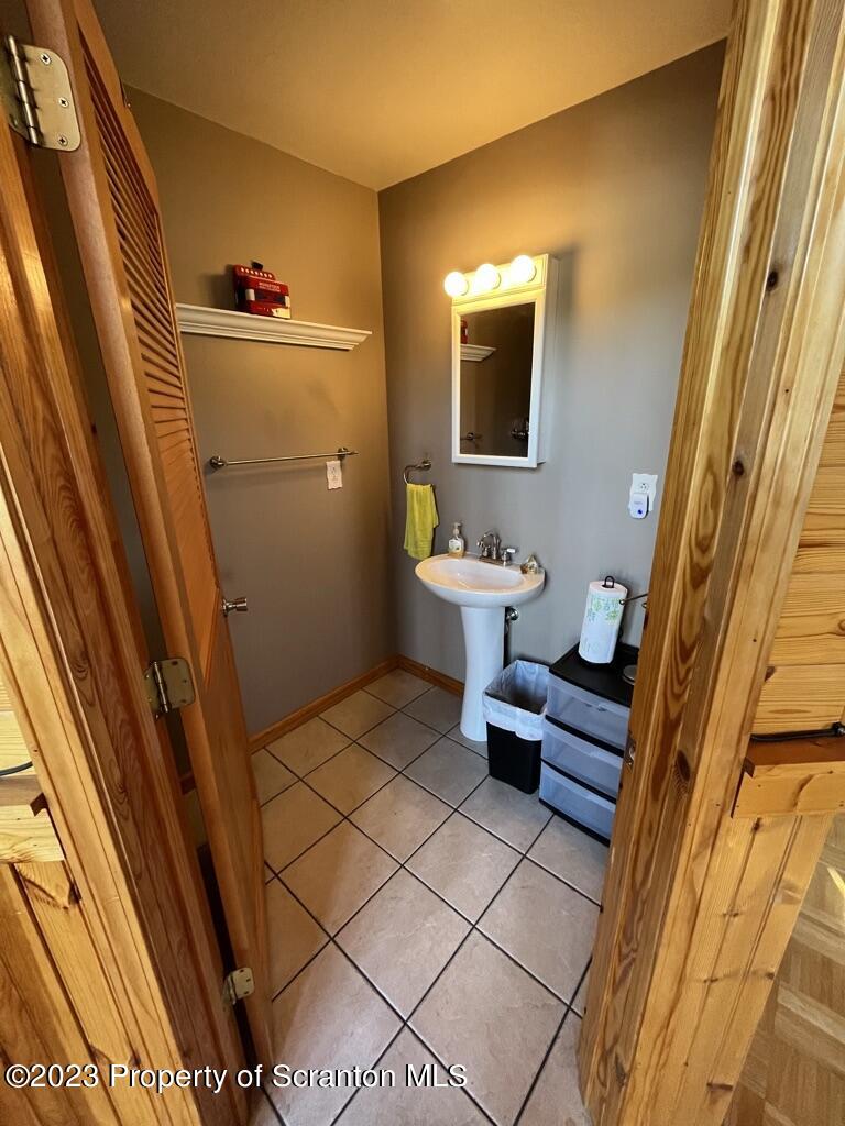 14651 Highway 858 Little Meadows, PA 18830 - Photo 24 of 51 a bathroom with a sink and a mirror