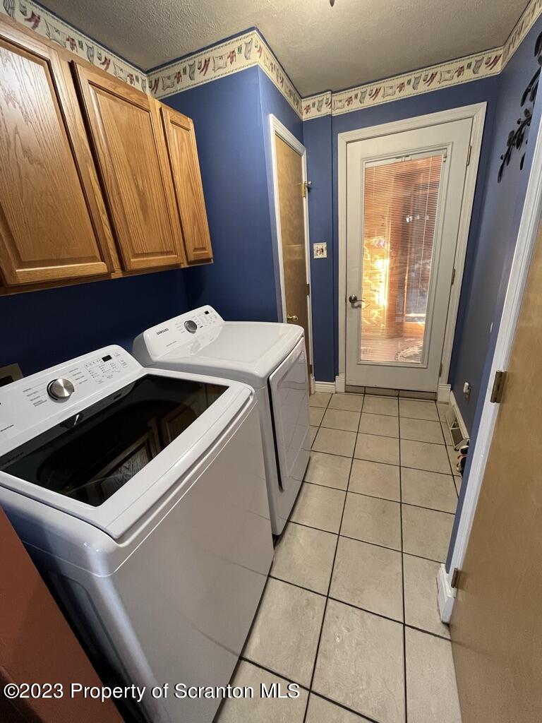14651 Highway 858 Little Meadows, PA 18830 - Photo 26 of 51 a utility room with dryer and washer