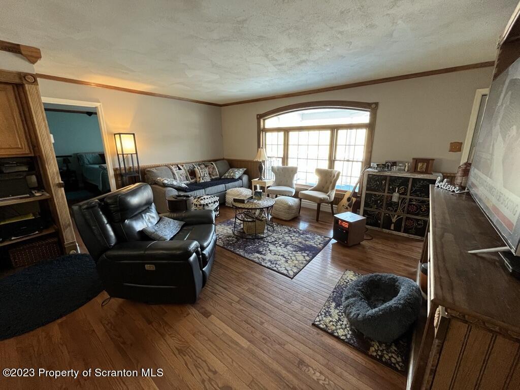 14651 Highway 858 Little Meadows, PA 18830 - Photo 29 of 51 a living room with furniture and a flat screen tv