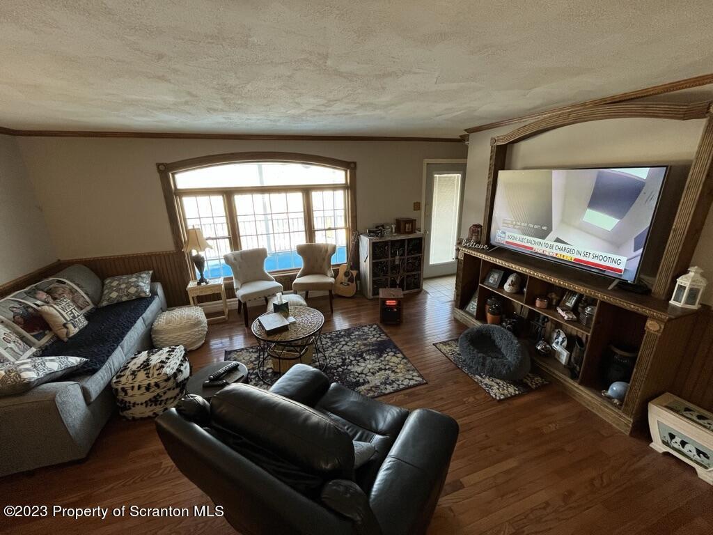 14651 Highway 858 Little Meadows, PA 18830 - Photo 30 of 51 a living room with furniture a rug and a window