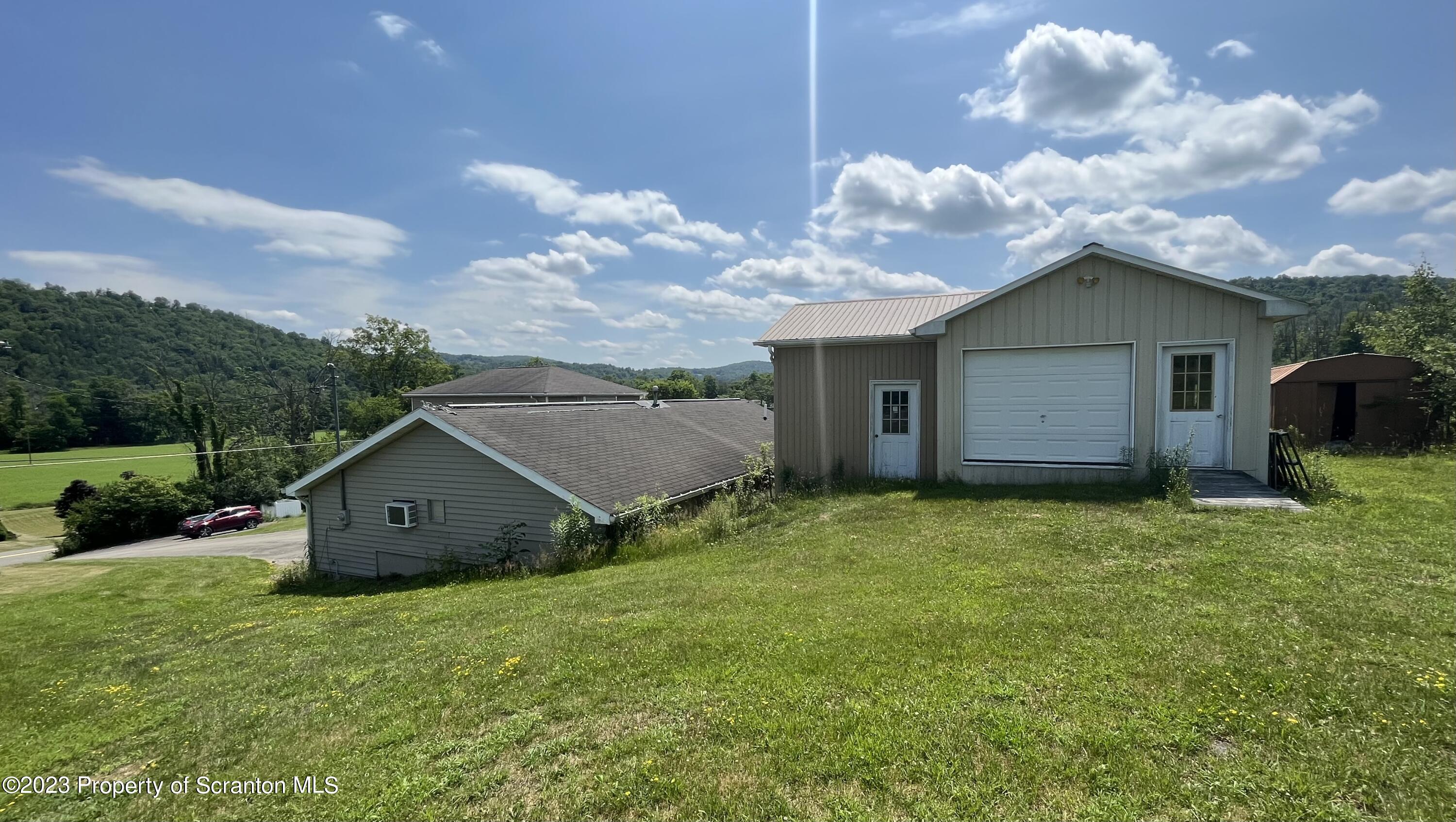 14651 Highway 858 Little Meadows, PA 18830 - Photo 5 of 51 a view of a house with wooden fence and a yard