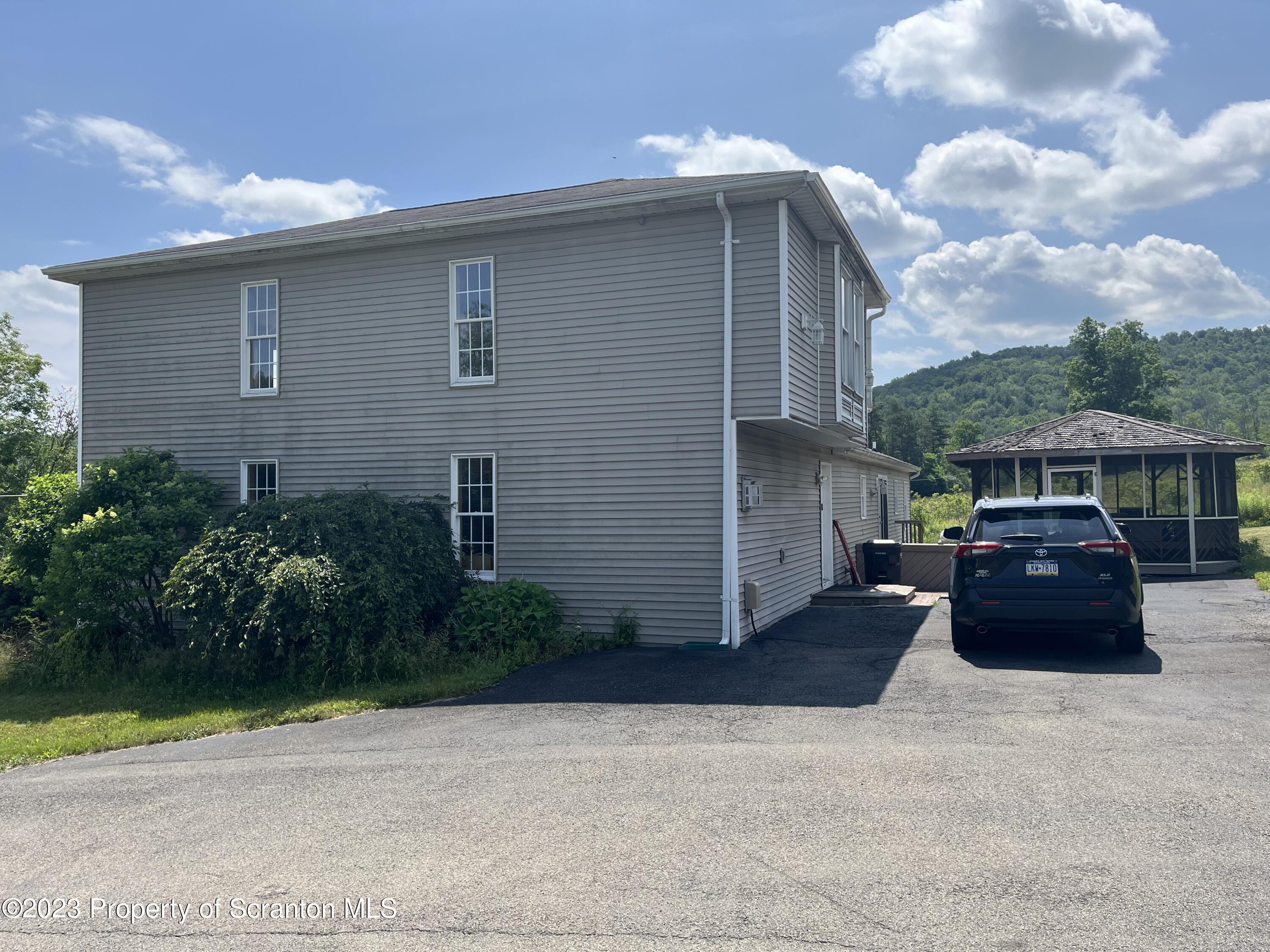 14651 Highway 858 Little Meadows, PA 18830 - Photo 8 of 51 a front view of a house with a yard