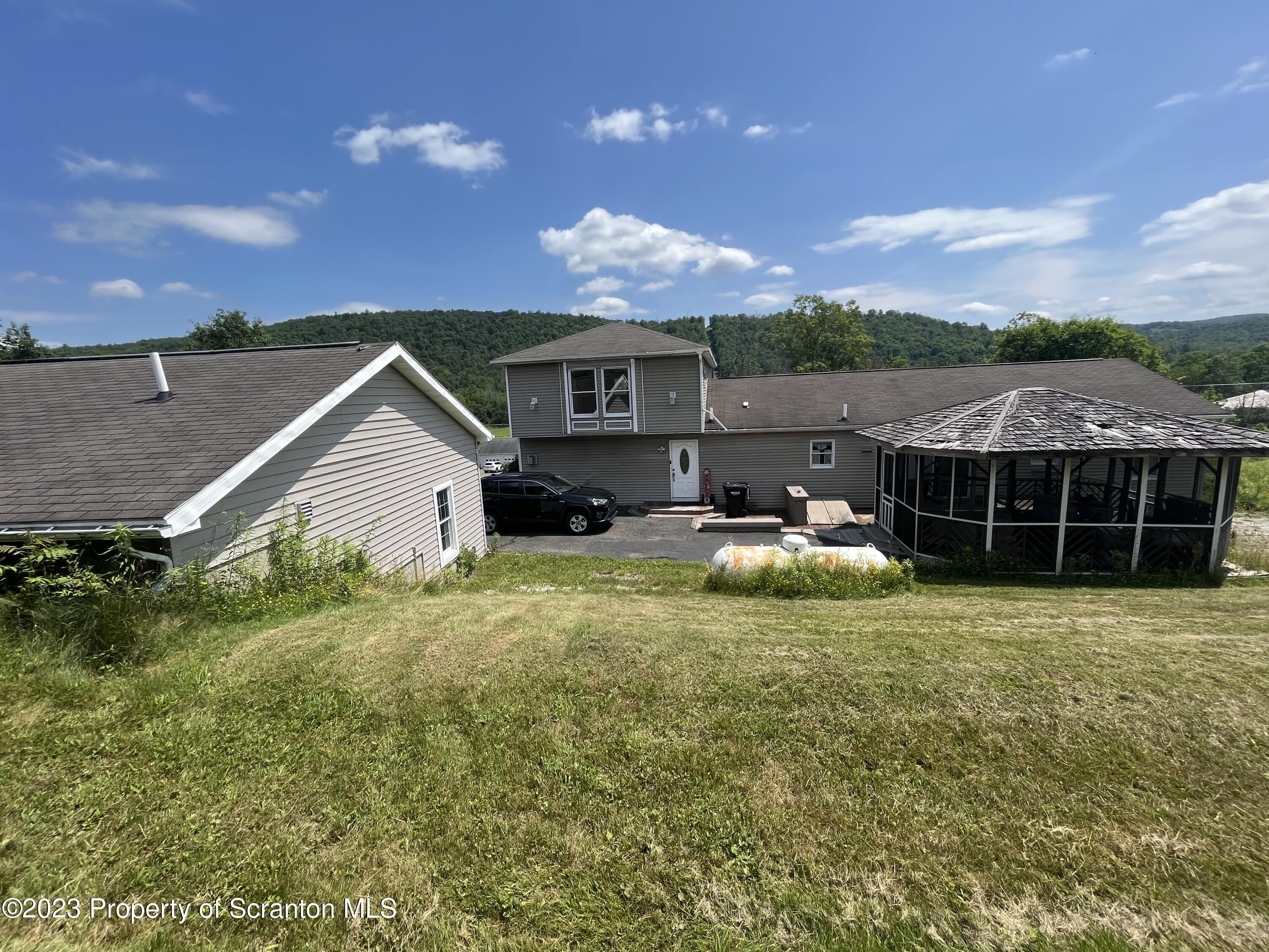 14651 Highway 858 Little Meadows, PA 18830 - Photo 9 of 51 a view of a house with a yard