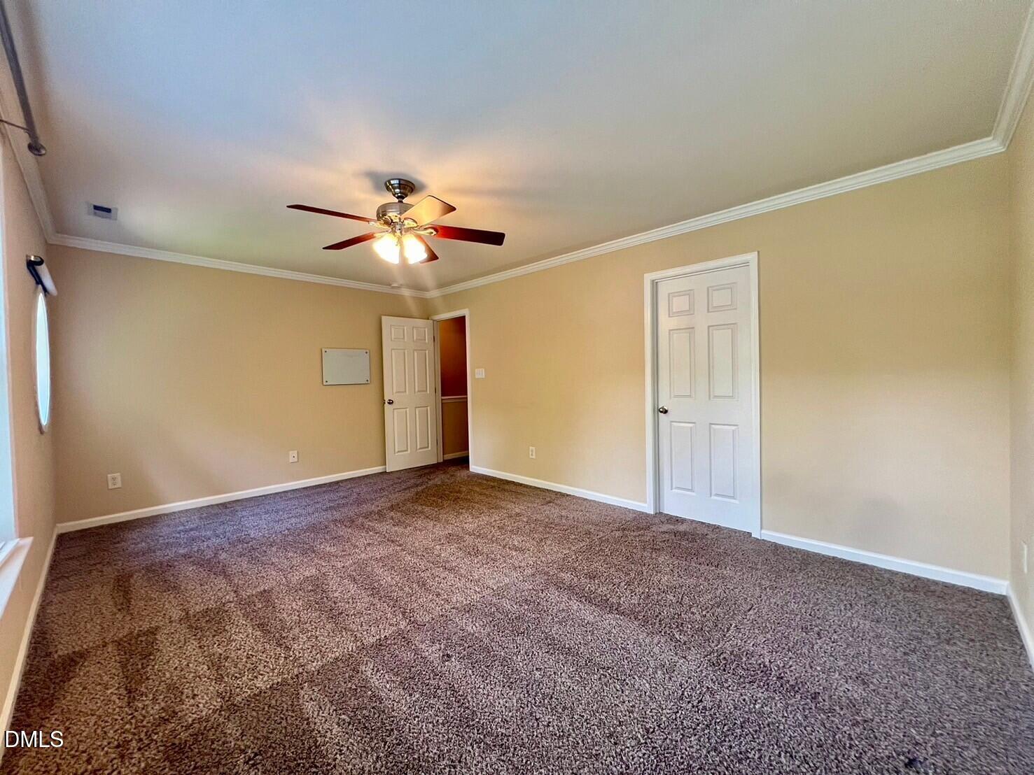 9912 Layla Avenue Raleigh, NC 27617 - Photo 12 of 25 a view of a room with a ceiling fan