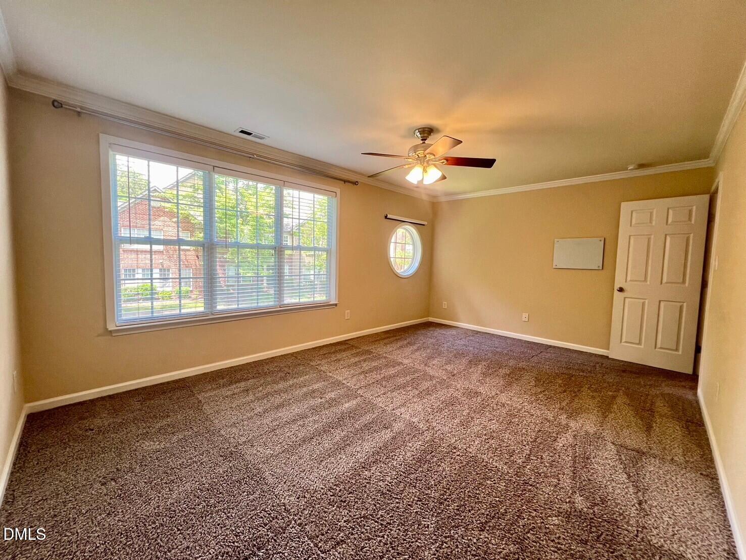 9912 Layla Avenue Raleigh, NC 27617 - Photo 13 of 25 wooden floor in an empty room with a window