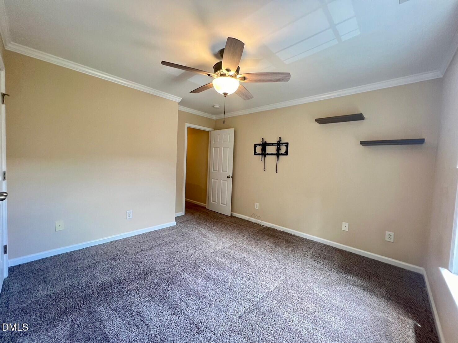 9912 Layla Avenue Raleigh, NC 27617 - Photo 17 of 25 a view of an empty room with a window