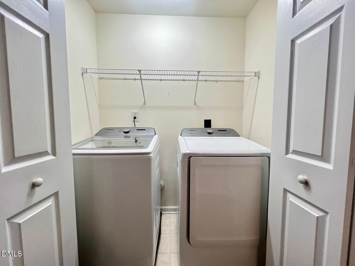 9912 Layla Avenue Raleigh, NC 27617 - Photo 21 of 25 a utility room with dryer and washer