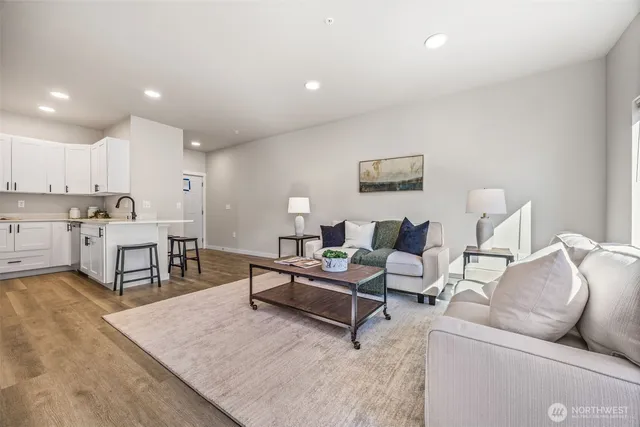 a living room with furniture and a table