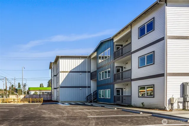a view of multiple houses with a street