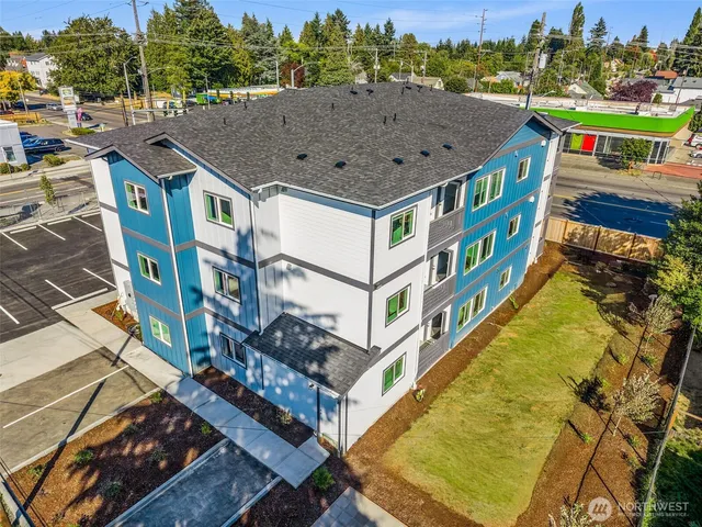an aerial view of houses with a swimming pool