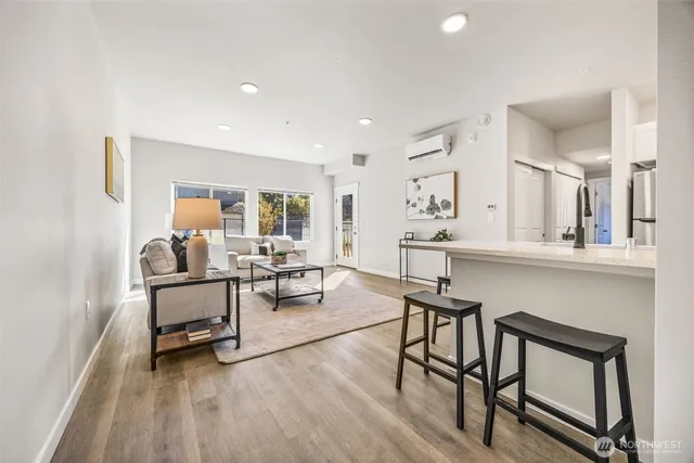 a view of a livingroom with furniture and a wooden floor