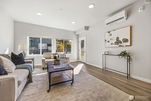 a living room with furniture and a large window