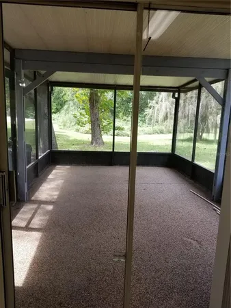 a view of a room with large windows