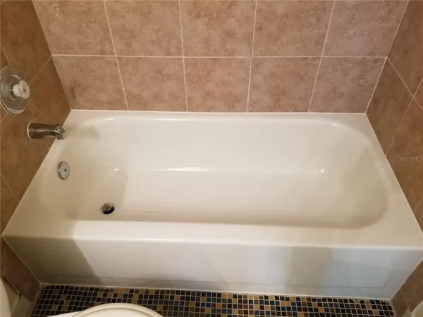 a bathroom with a bath tub