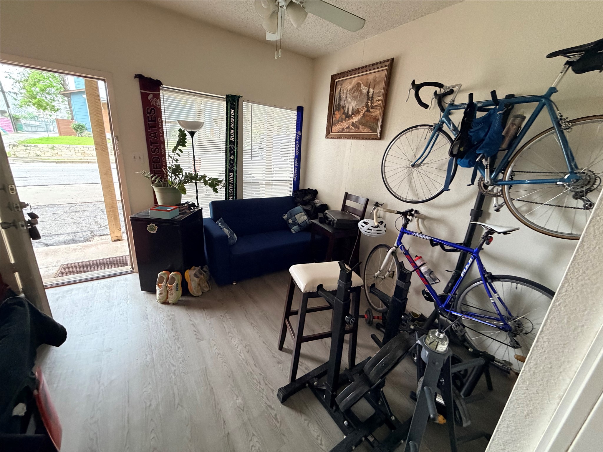 3000 Guadalupe Street, Unit 106 Austin, TX 78705 - Photo 6 of 9 a living room with furniture a window and gym equipment