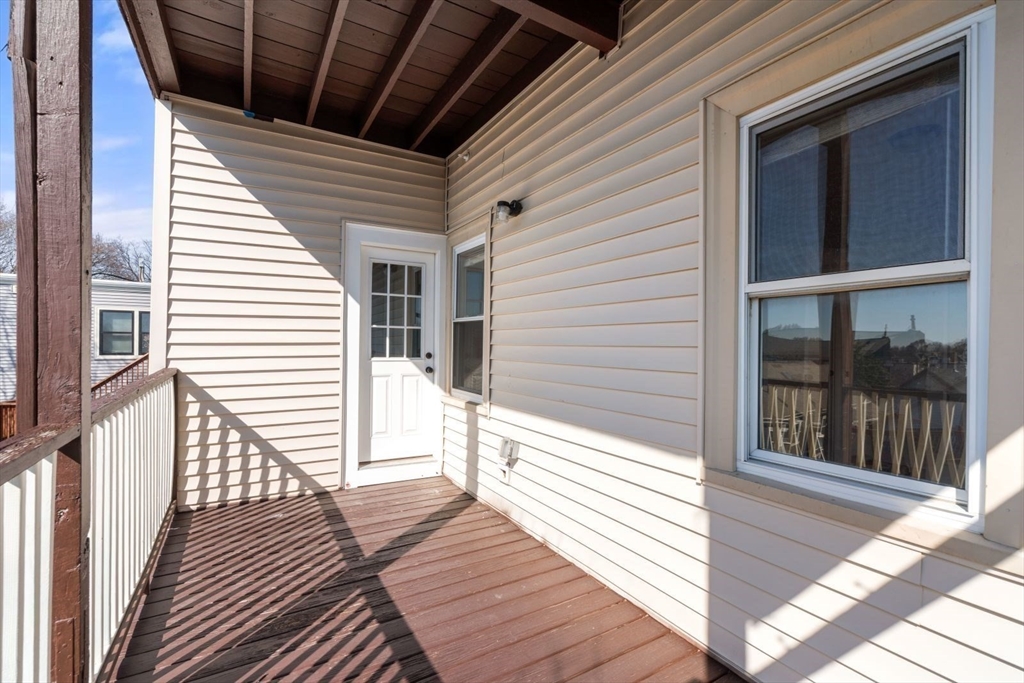 10 Centre Avenue, Unit 5 Boston, MA 02124 - Photo 17 of 24 a view of a balcony with wooden floor