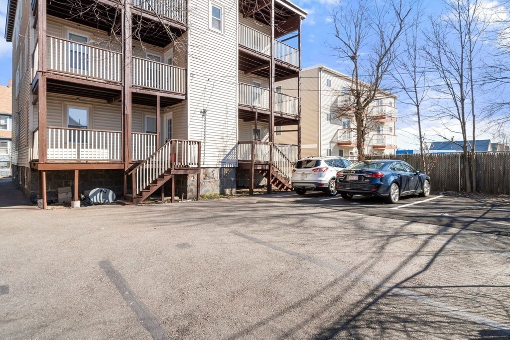 10 Centre Avenue, Unit 5 Boston, MA 02124 - Photo 19 of 24 a car parked in front of a building