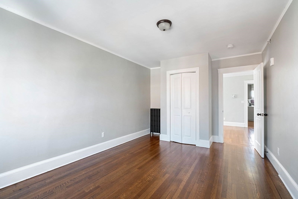 10 Centre Avenue, Unit 5 Boston, MA 02124 - Photo 10 of 24 a view of a room with wooden floor