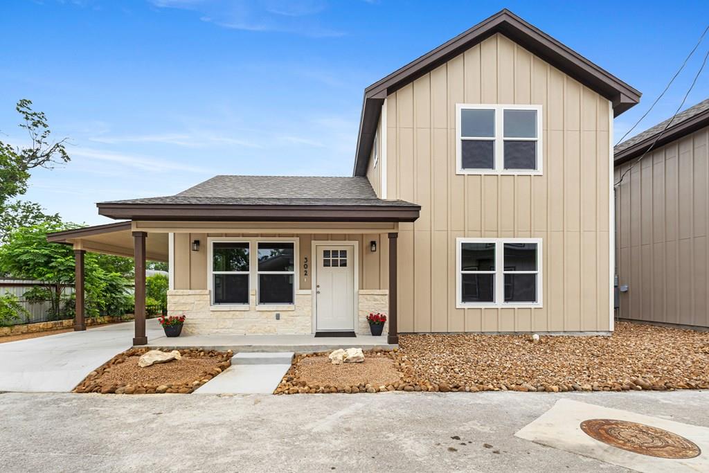 302 Riley Way Kerrville, TX 78028 - Photo 1 of 1 a front view of a house with garden
