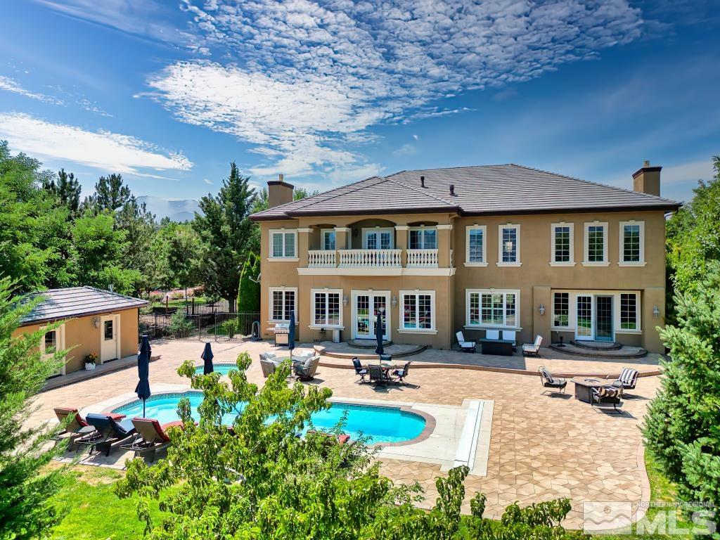 a front view of a house with swimming pool
