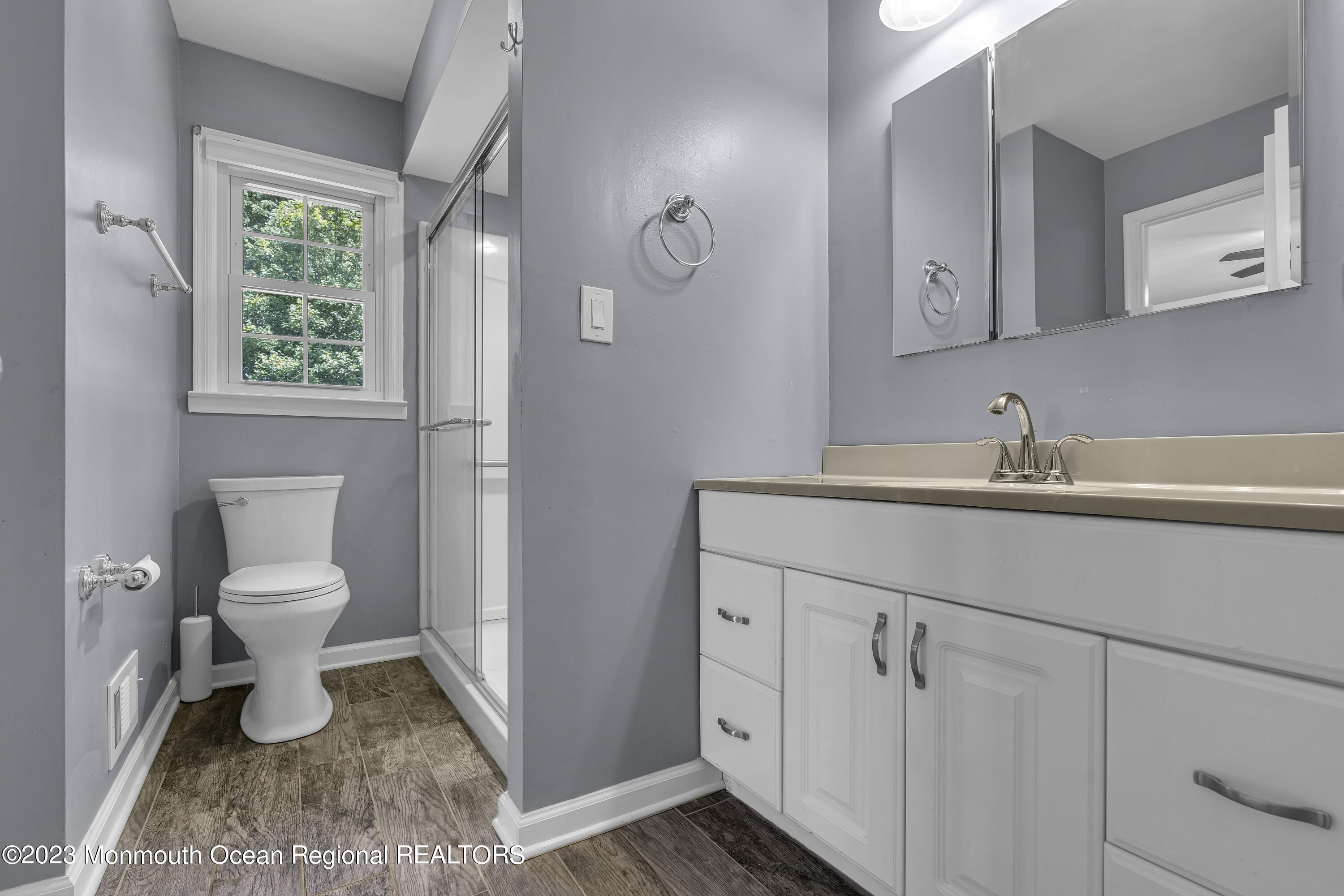 44 Danemar Drive Matawan, NJ 07747 - Photo 17 of 31 a bathroom with a toilet sink and mirror