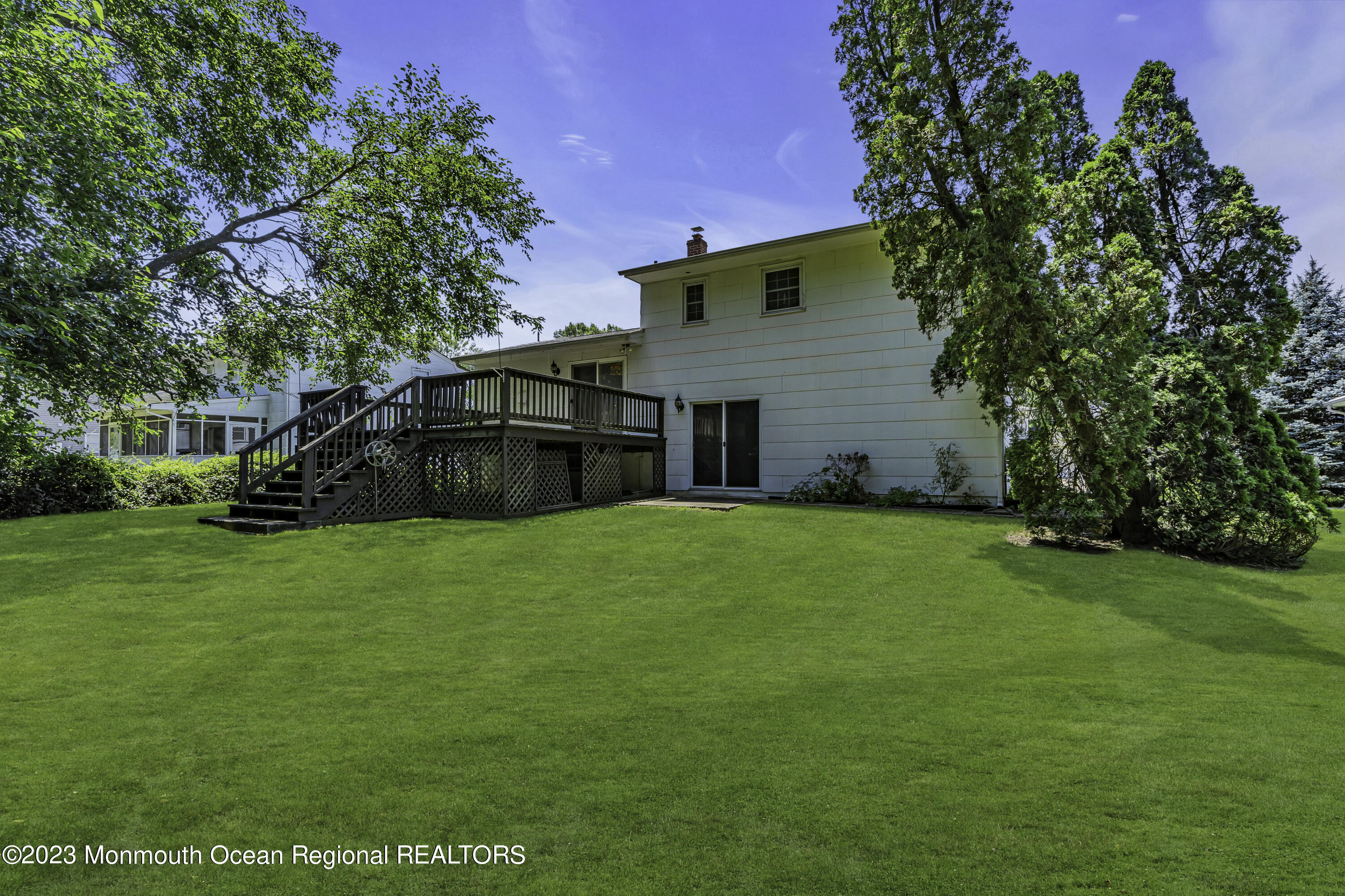 44 Danemar Drive Matawan, NJ 07747 - Photo 26 of 31 a backyard of a house with lots of green space