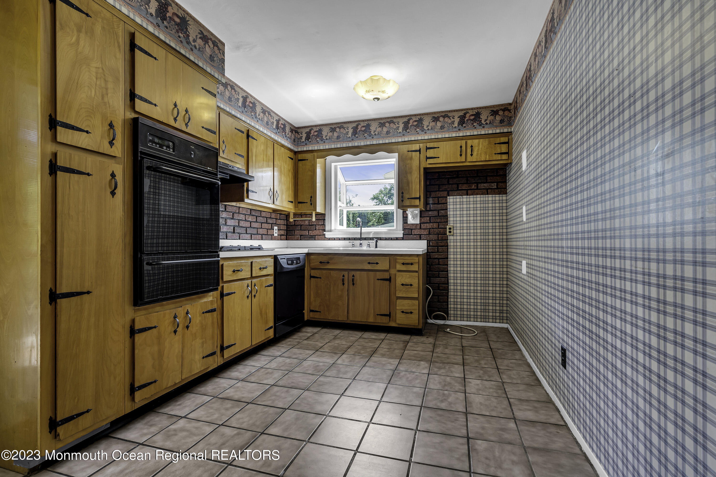 44 Danemar Drive Matawan, NJ 07747 - Photo 10 of 31 a kitchen with stainless steel appliances a stove sink and cabinets