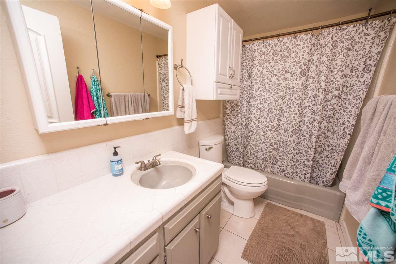 2480 Trentham Way Reno, NV 89509 - Photo 17 of 27 a bathroom with a sink and a mirror